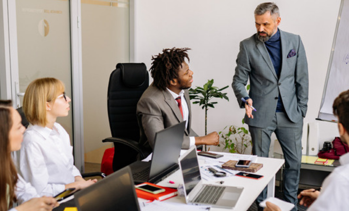 Project leaders discussing priorities in a meeting room